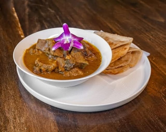 Curry Goat Roti.